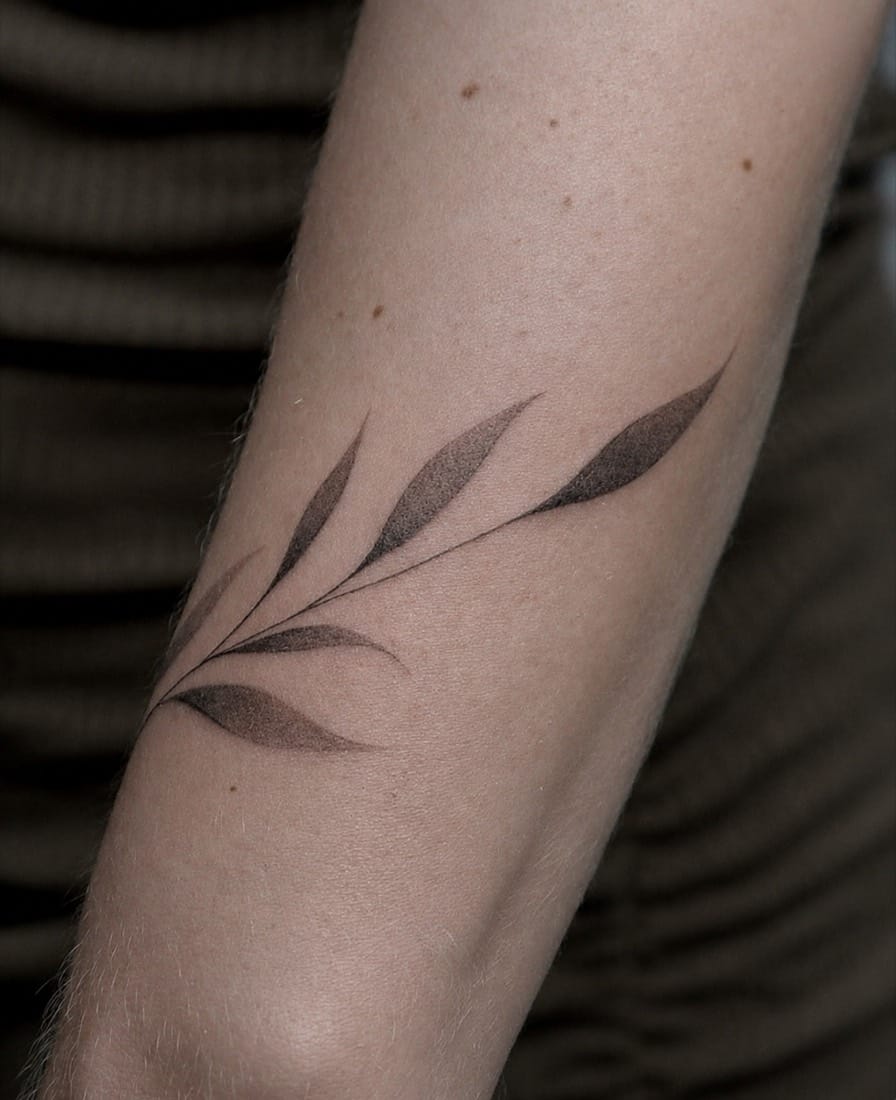 Fine line botanical branch tattoo by a Essex Fine Line Tattoo Academy student