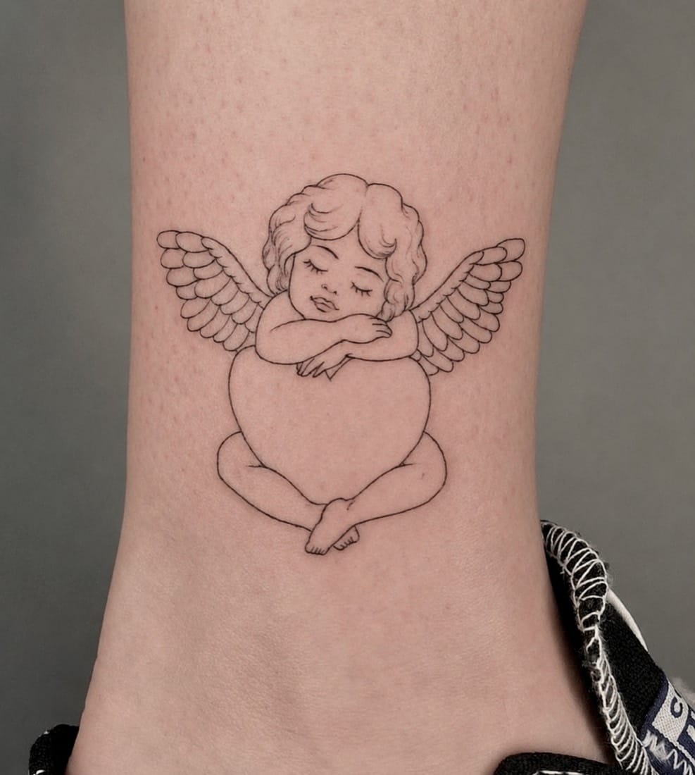 Fine line cherub angel tattoo by an Essex Fine Line Tattoo Academy student